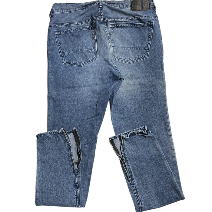 Distressed blue denim jeans