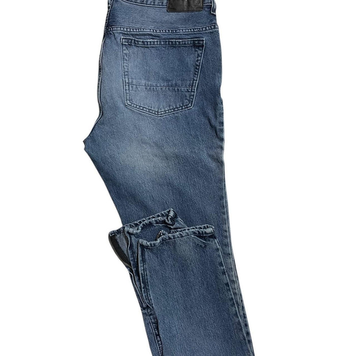 Distressed blue denim jeans