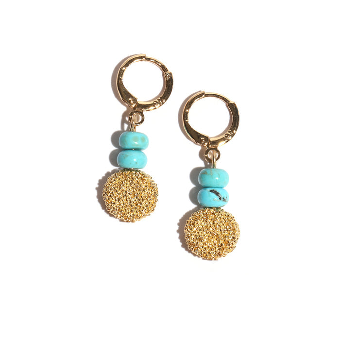 Gold hoop earrings with turquoise beads on a white background
