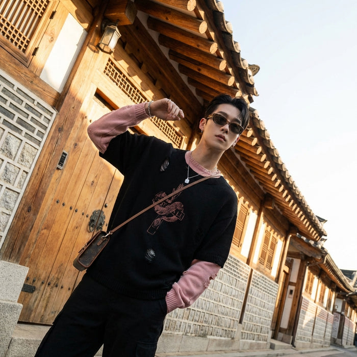 Pull oversize noir déchiré style streetwear coréen pour homme et femme