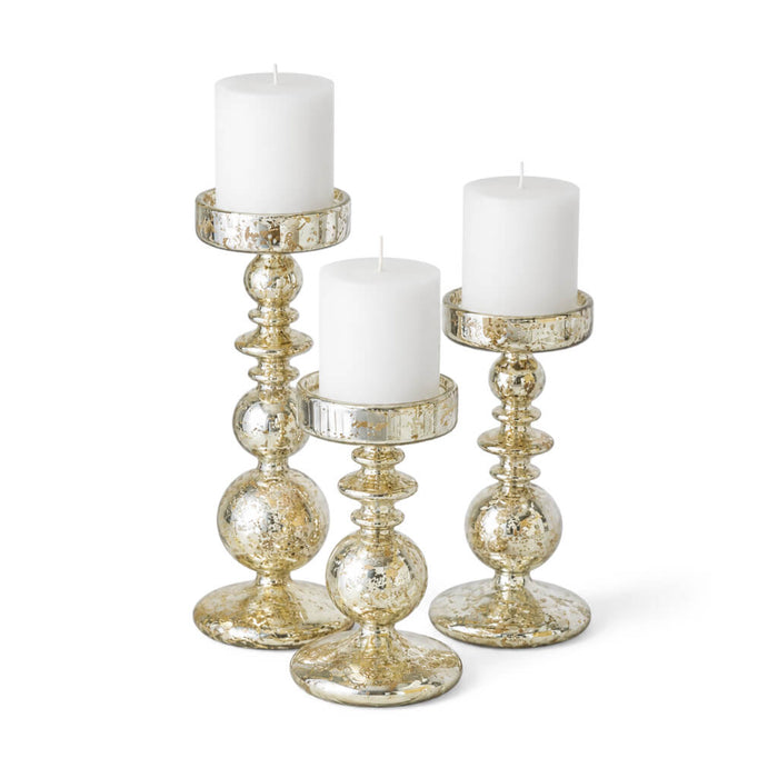 Set of unique mercury bubble pillar candle holders with white candles