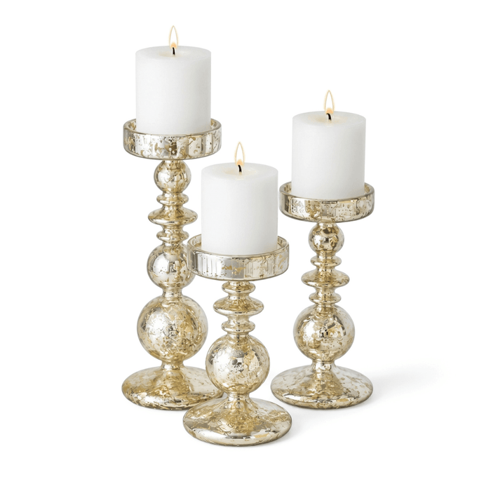 Set of 8.5" unique mercury bubble pillar candle holders with lit white candles