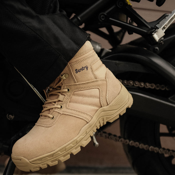 Tan boot with 'Sentry' branding on a motorcycle.