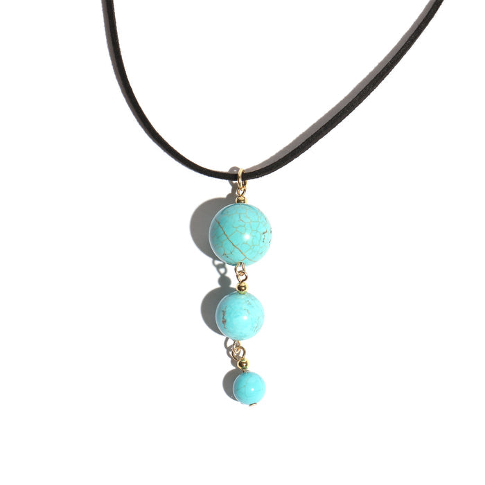 Necklace with turquoise beads on a white background