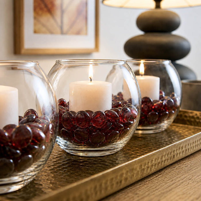 Glass bowl vases with candles and ruby red vase gems